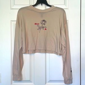 Cream colored “Over It” Long sleeve crop top